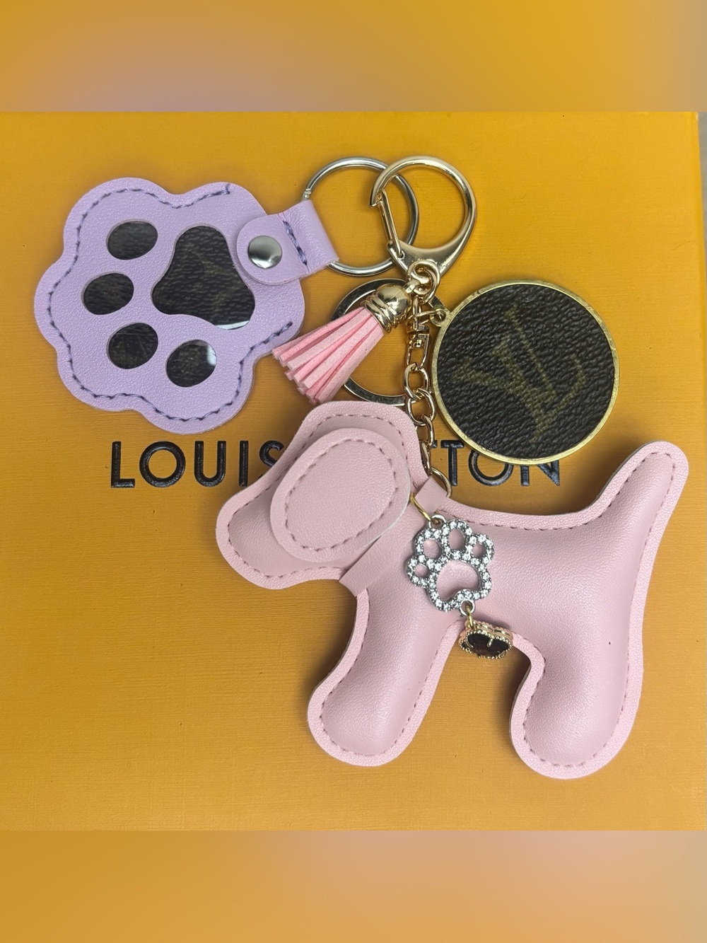 Authentic Louis Vuitton
Material Bag Charm, Dog and Paw, Upcycled